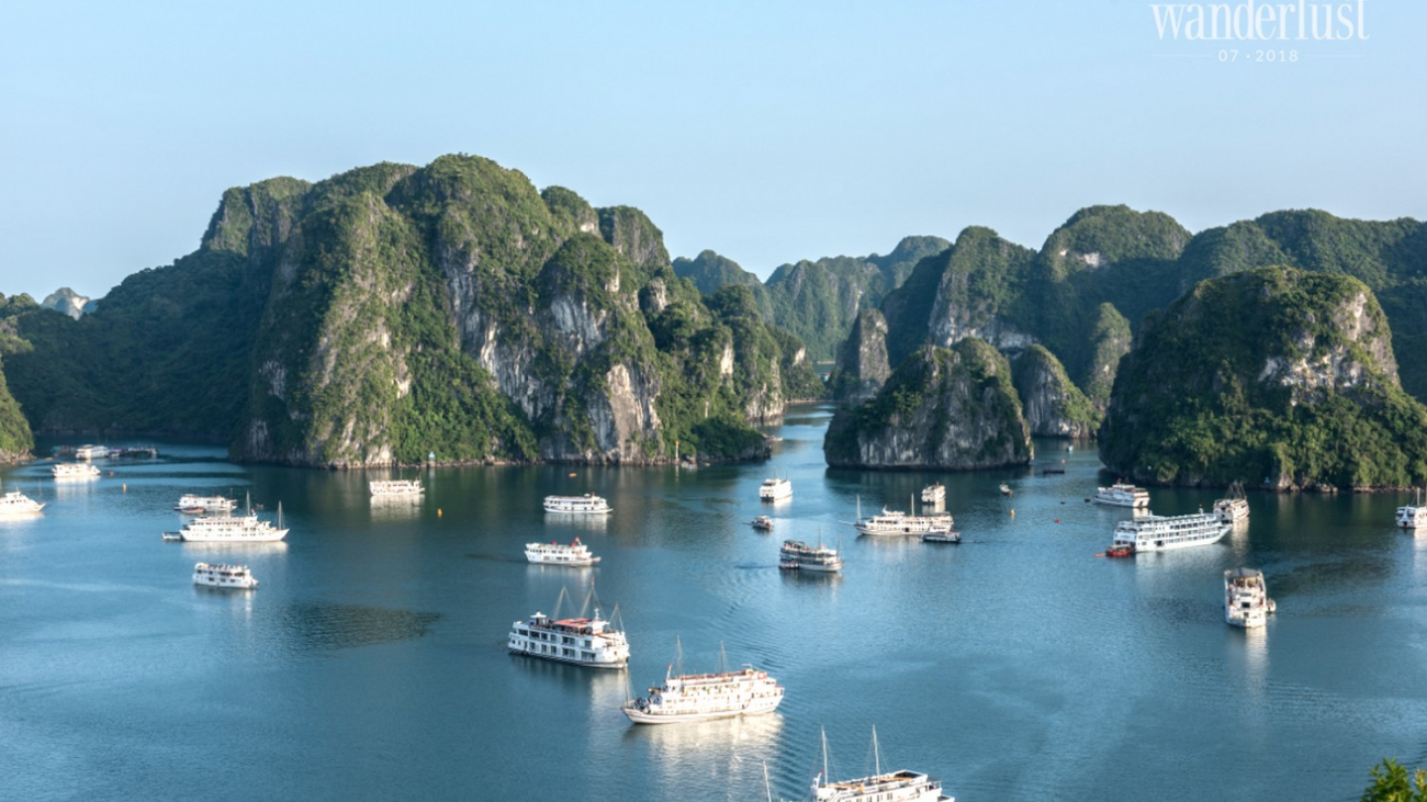 Wanderlust Tips Magazine | Admire the sunrise amidst the limestones in Ha Long Bay